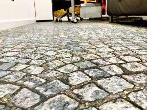 Cobblestone-effect floor graphic in an office