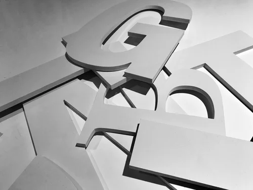 Stack of white cut-out 3D letters