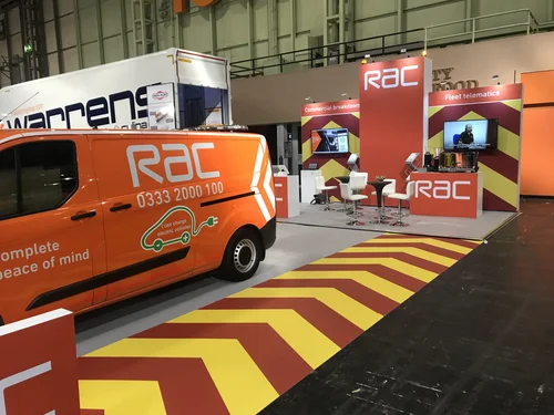 Red and yellow chevron floor graphics on an RAC exhibition stand