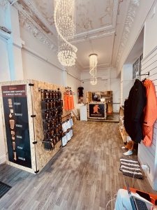 Retail shop interior with printed wall displays and chandeliers