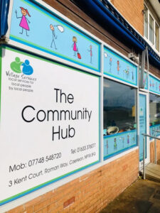 The Community Hub window and fascia graphics on a shopfront