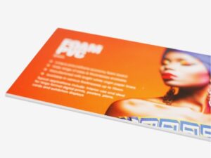 Foam PVC sample printed in orange with a portrait and product details